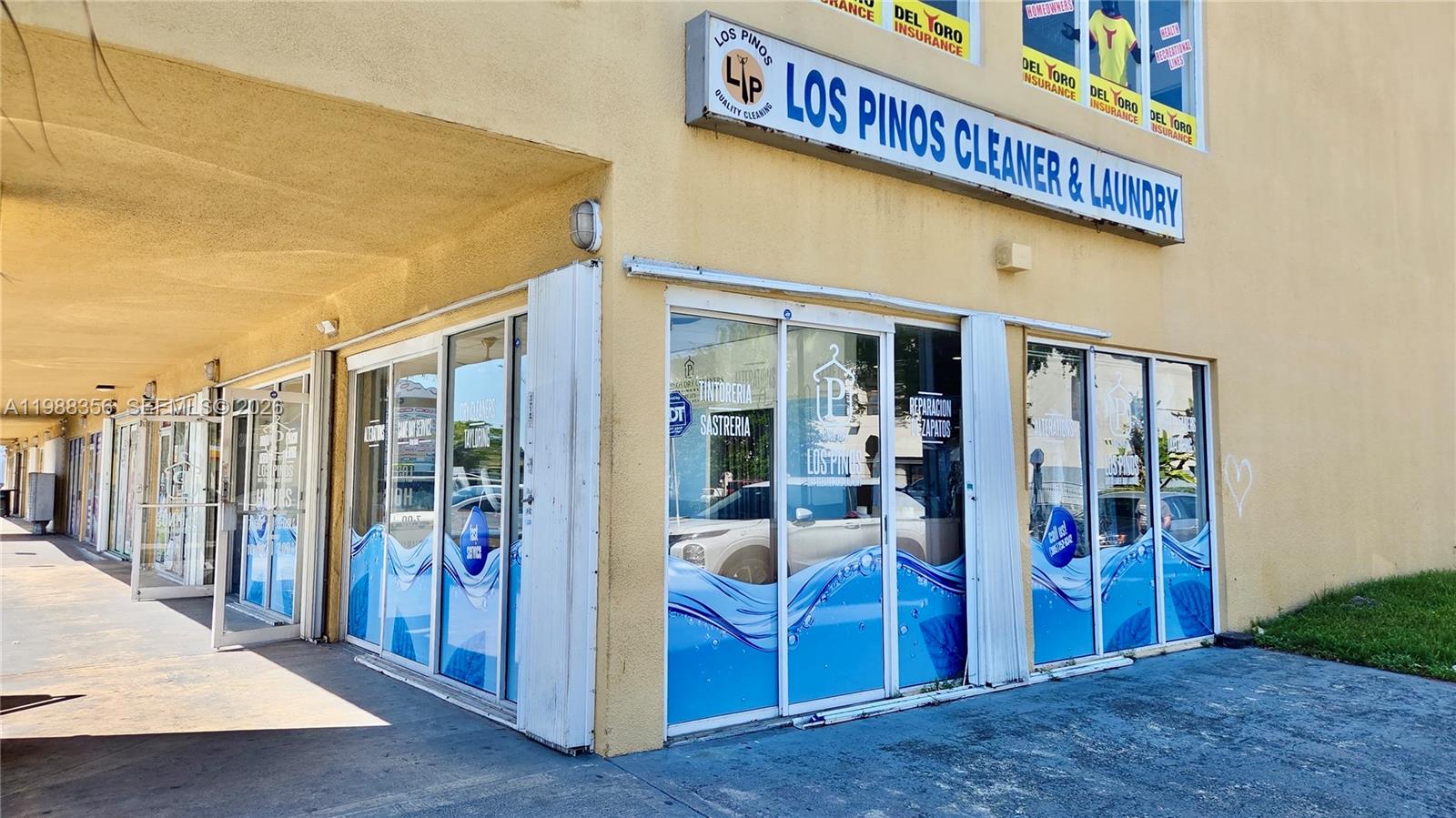 The exterior of a Los Pinos Cleaner and Laundry storefront with glass doors and windows — 4222 W 16th Ave, Hialeah FL 33012, HIALEAH, FL