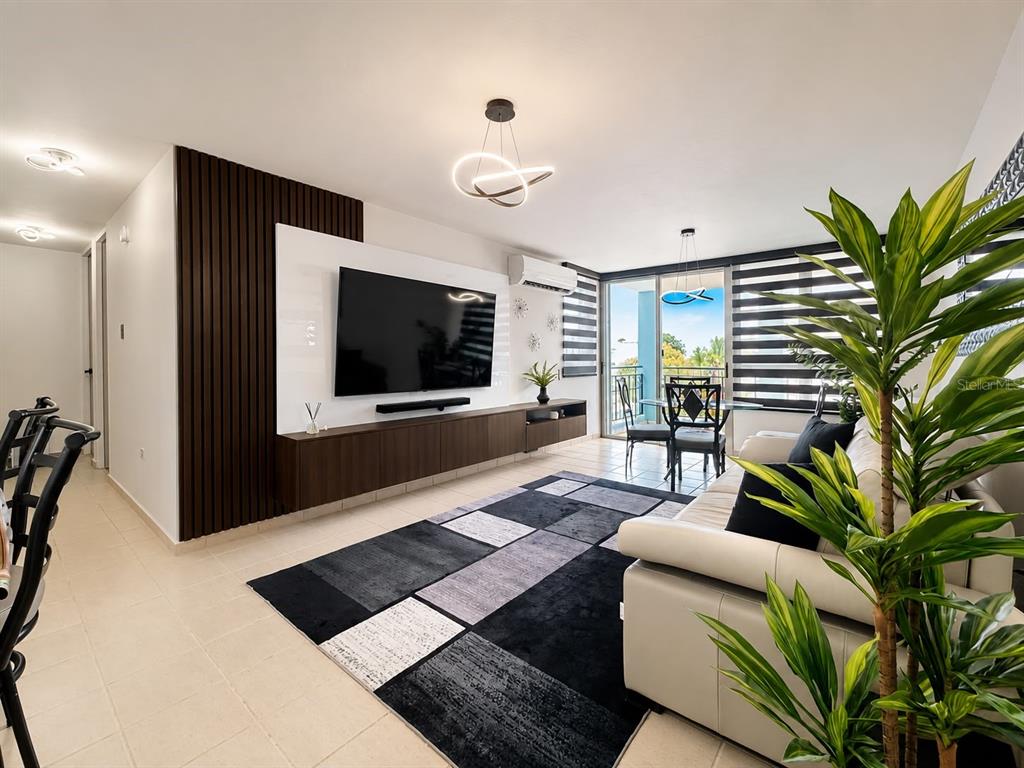 The gated entrance of the Costa Brava residential complex features a guardhouse and palm trees — COND. COSTA BRAVA EDIF. 9 UNIT #301, CEIBA, PR