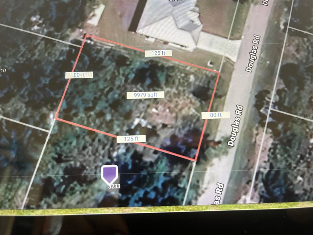 This is an aerial map showing a rectangular property lot with dimensions and square footage — 3225 DOUGLAS ROAD, PORT CHARLOTTE, FL