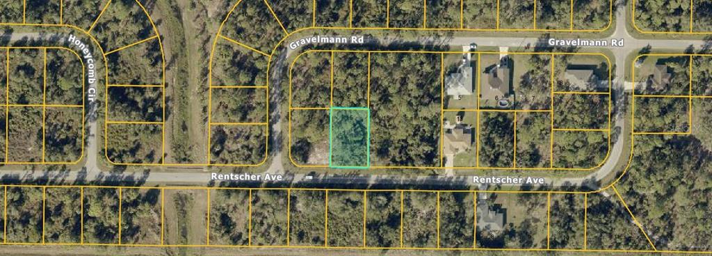 This is an aerial map showing a highlighted vacant lot located at a street intersection — Lot 16 RENTSCHER AVENUE, NORTH PORT, FL