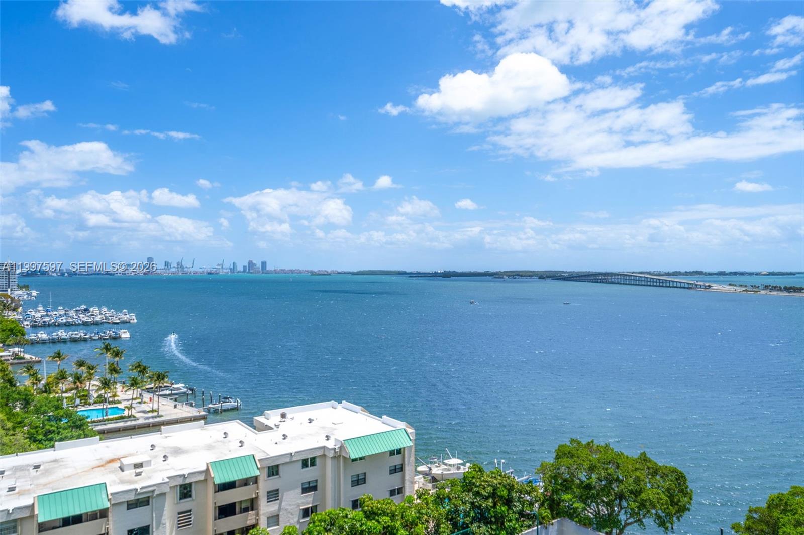 An elevated view of a bay with a bridge, boats, and waterfront buildings — 2333 Brickell Ave # 1109, Miami FL 33129, MIAMI, FL