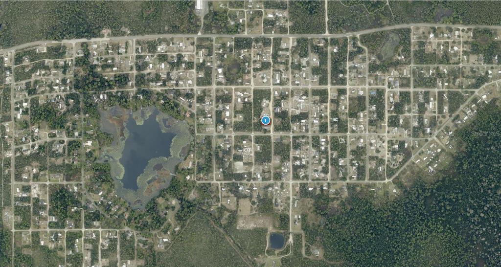 This aerial map shows a residential neighborhood with a marked lot near a lake — 14-17-28-0200-004-04100 OAK STREET, PAISLEY, FL