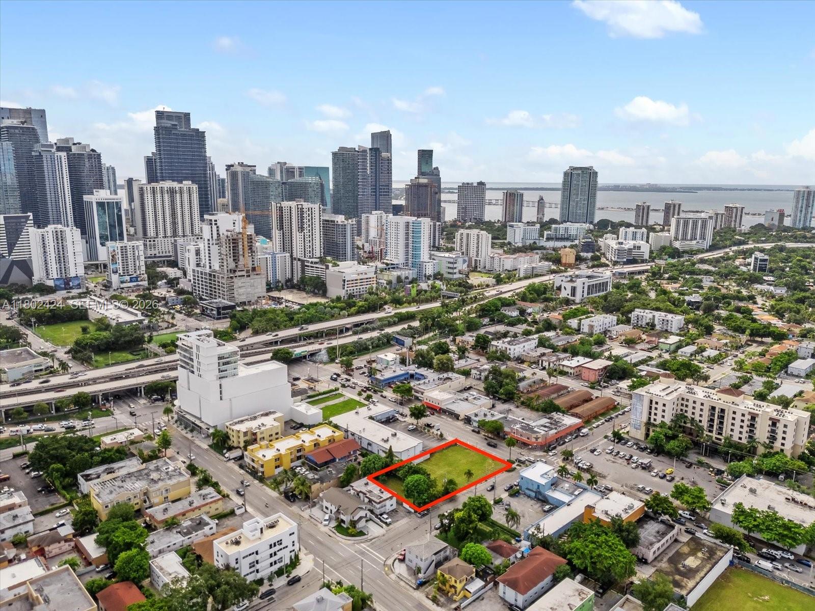 An aerial view shows a vacant rectangular lot outlined in red within a city neighborhood — 471 & 719 SW 8th St & 5th Av, Miami FL 33130, MIAMI, FL