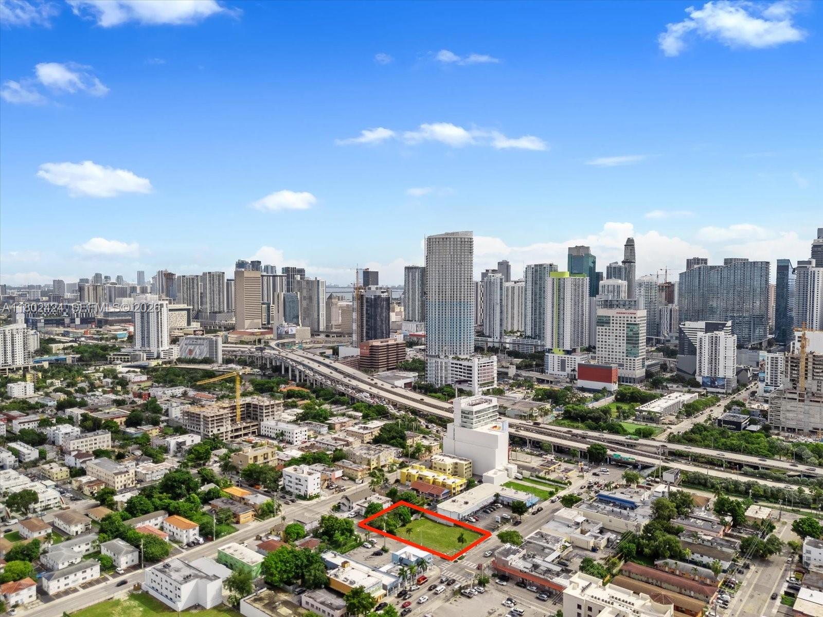 An aerial view shows a vacant rectangular lot outlined in red within a city — 471 & 719 SW 8th St & 5th Av, Miami FL 33130, MIAMI, FL
