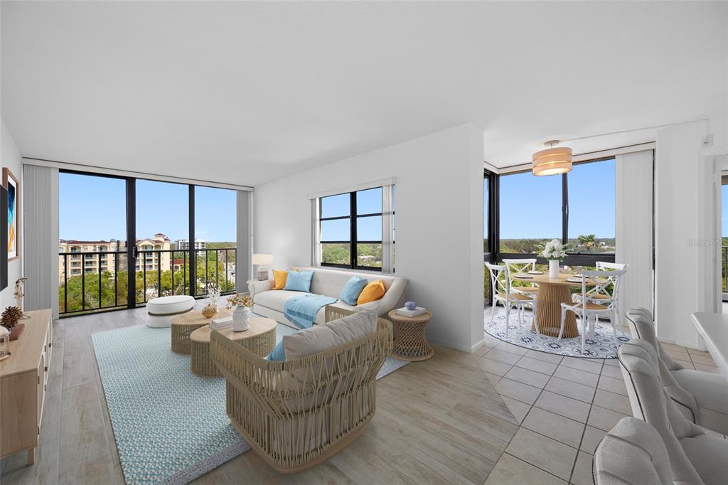 A bright living and dining area with floor-to-ceiling windows and light wood-look flooring — 500 N OSCEOLA AVENUE UNIT 810, CLEARWATER, FL
