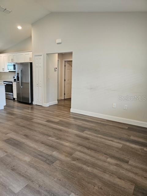 A view of a kitchen with stainless steel appliances and wood-look flooring — 2292 SW 168TH LOOP, OCALA, FL
