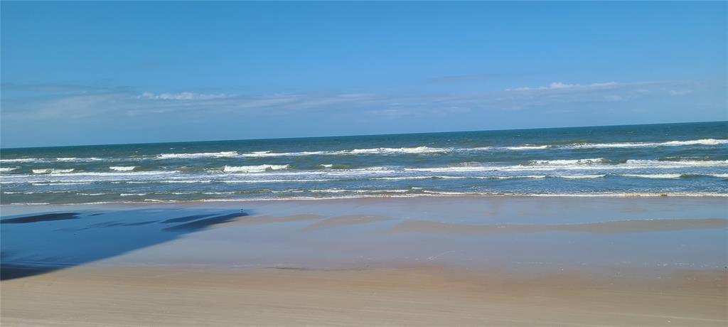 A view of the ocean and sandy beach under a clear blue sky — 3051 S ATLANTIC AVENUE UNIT 1904, DAYTONA BEACH SHORES, FL