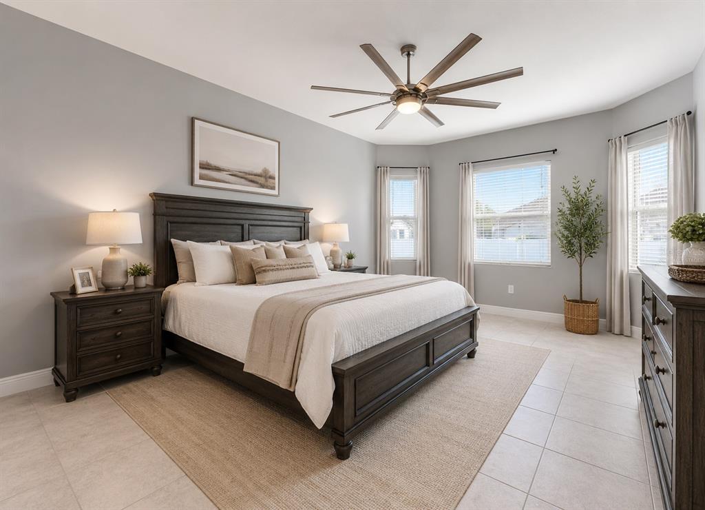 A bedroom features a dark wood bed frame, light gray walls, and tile flooring — 1252 KELSA ANNE DRIVE, SPRING HILL, FL
