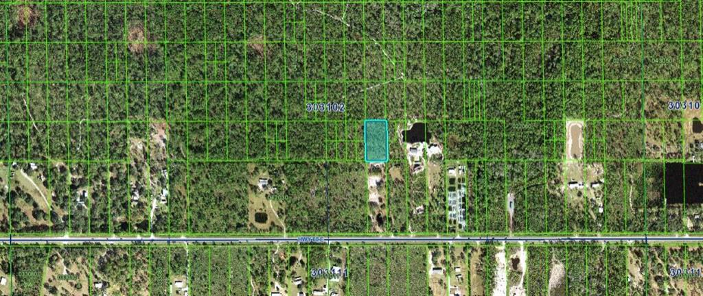 This aerial map shows a rectangular parcel of land highlighted in blue within a wooded area — N/A, LAKE WALES, FL