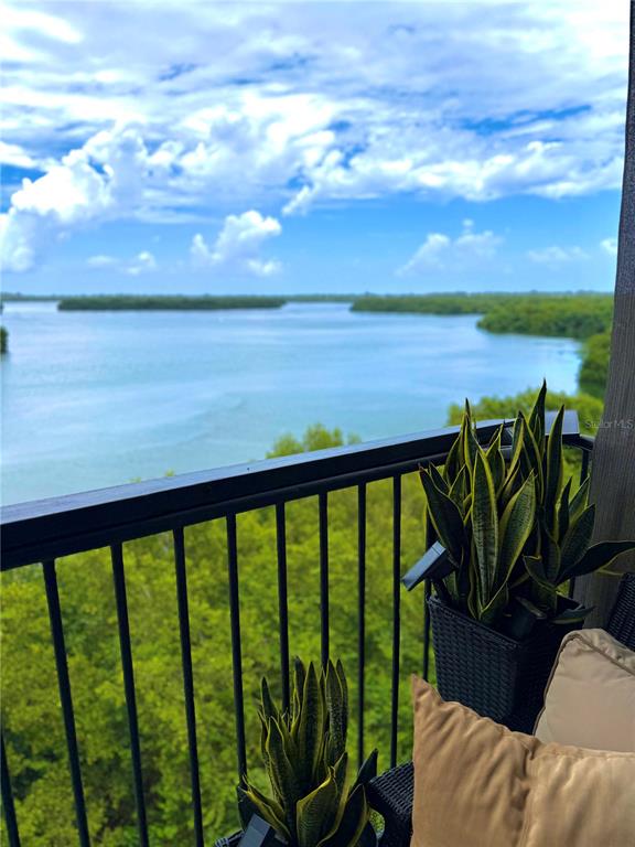 A balcony view overlooking a body of water and lush green trees — 1 CLUB COSTA MARINA UNIT 8-G, CAROLINA, PR