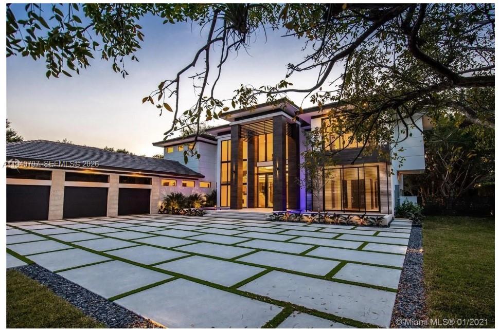 A modern two-story house with a large paved driveway and a prominent glass entryway — 6850 SW 73rd Ct, Miami FL 33143, MIAMI, FL