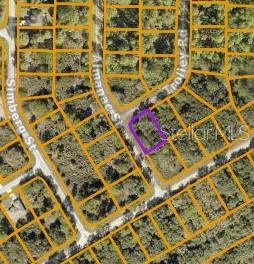 This is an aerial map showing a vacant lot highlighted in purple within a residential neighborhood — LOT 9 TROLLEY ROAD, NORTH PORT, FL