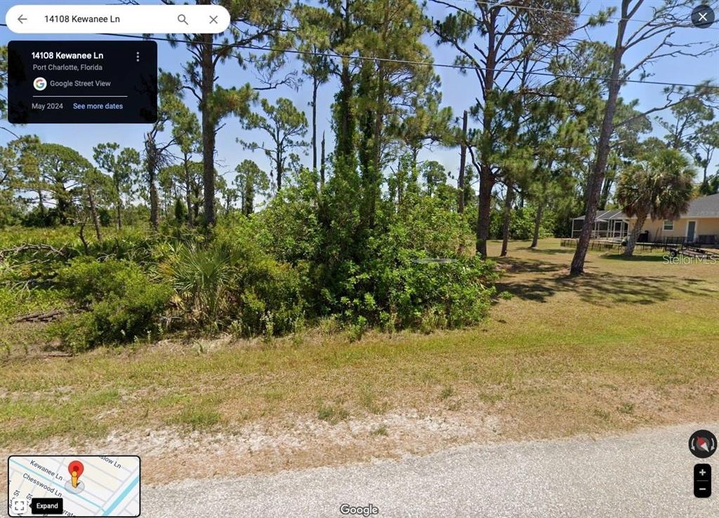 A vacant, wooded residential lot with scattered pine trees and native Florida vegetation — 14108 KEWANEE LANE, PORT CHARLOTTE, FL