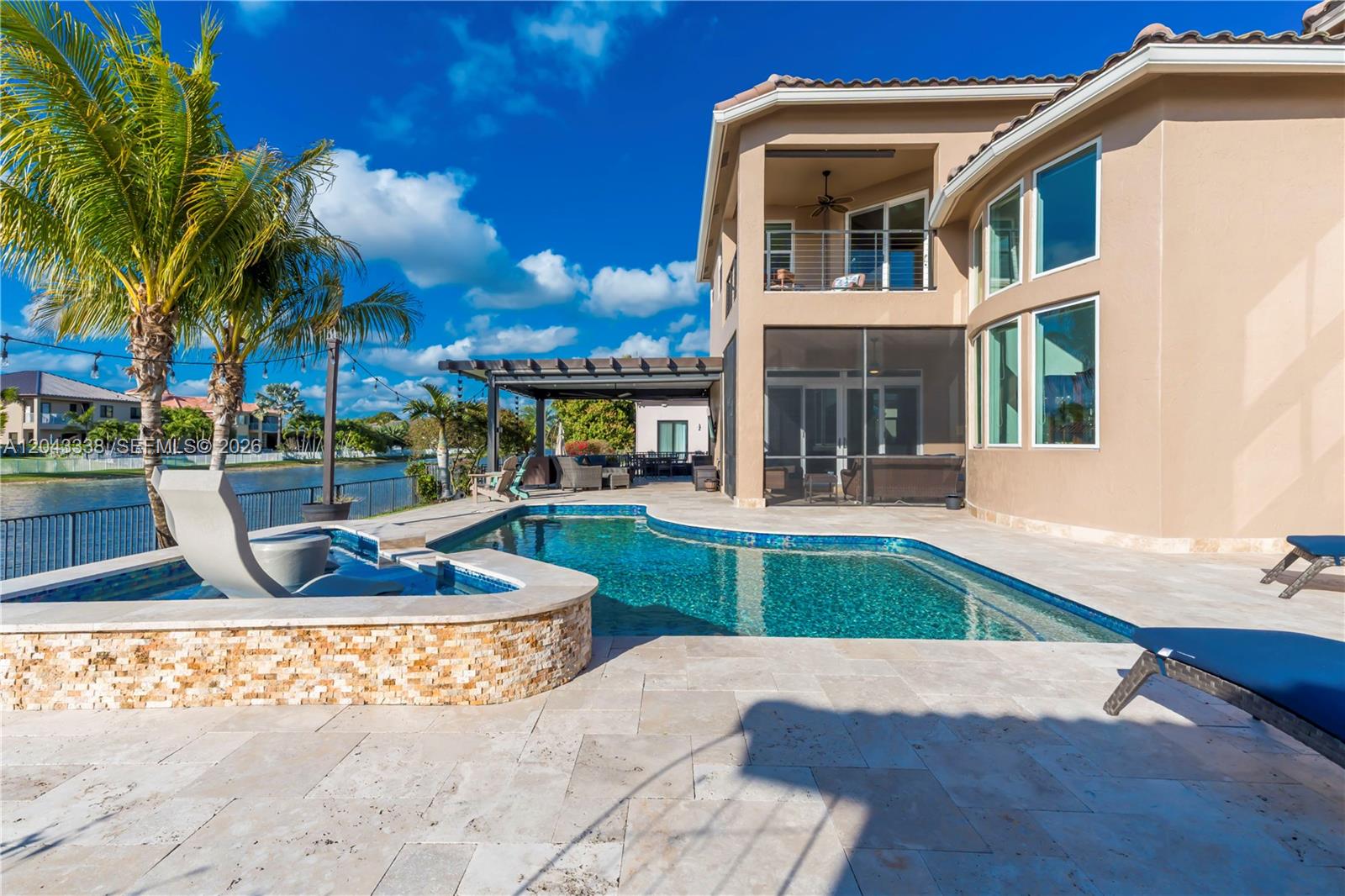 A two-story house with a pool, spa, and covered patio overlooking a canal — 3240 SW 190th Ave, Miramar FL 33029, MIRAMAR, FL