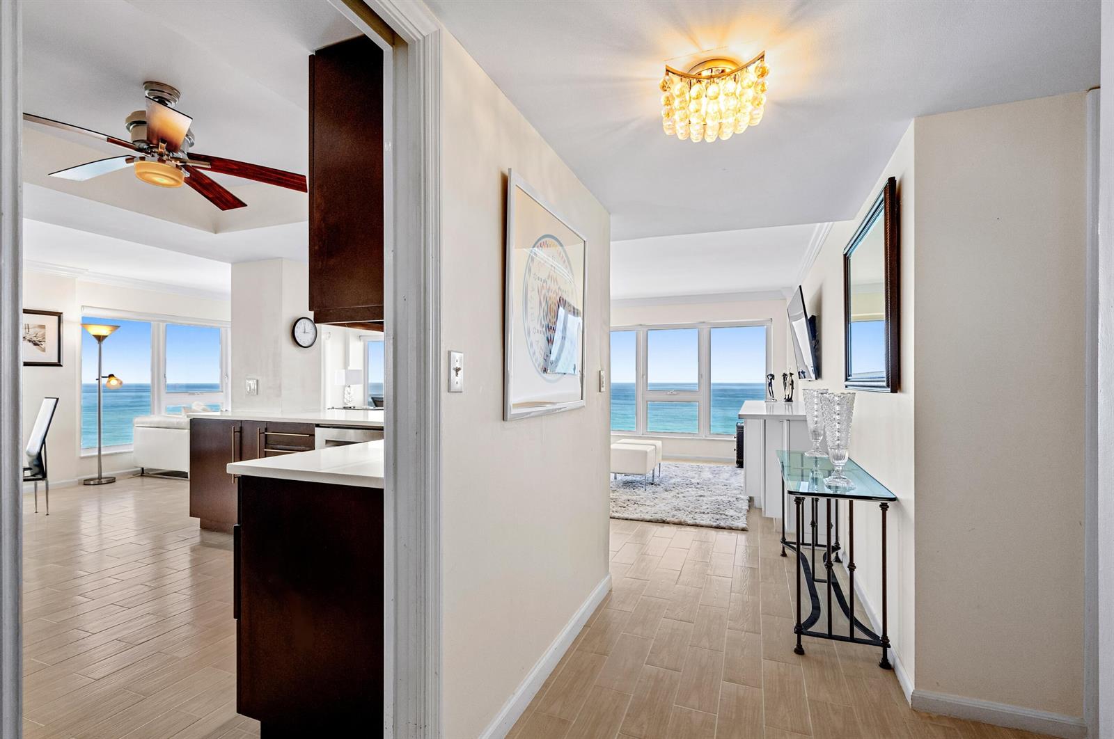 A view through a doorway into a bright apartment with ocean views and tile flooring — 2066 N Ocean Boulevard, Boca Raton FL 33431, BOCA RATON, FL