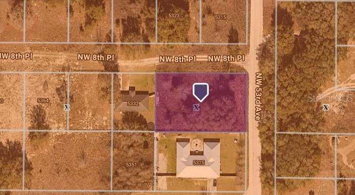 This is a satellite map view showing a vacant rectangular lot highlighted in purple — 5310 NW 8TH PL, OCALA, FL