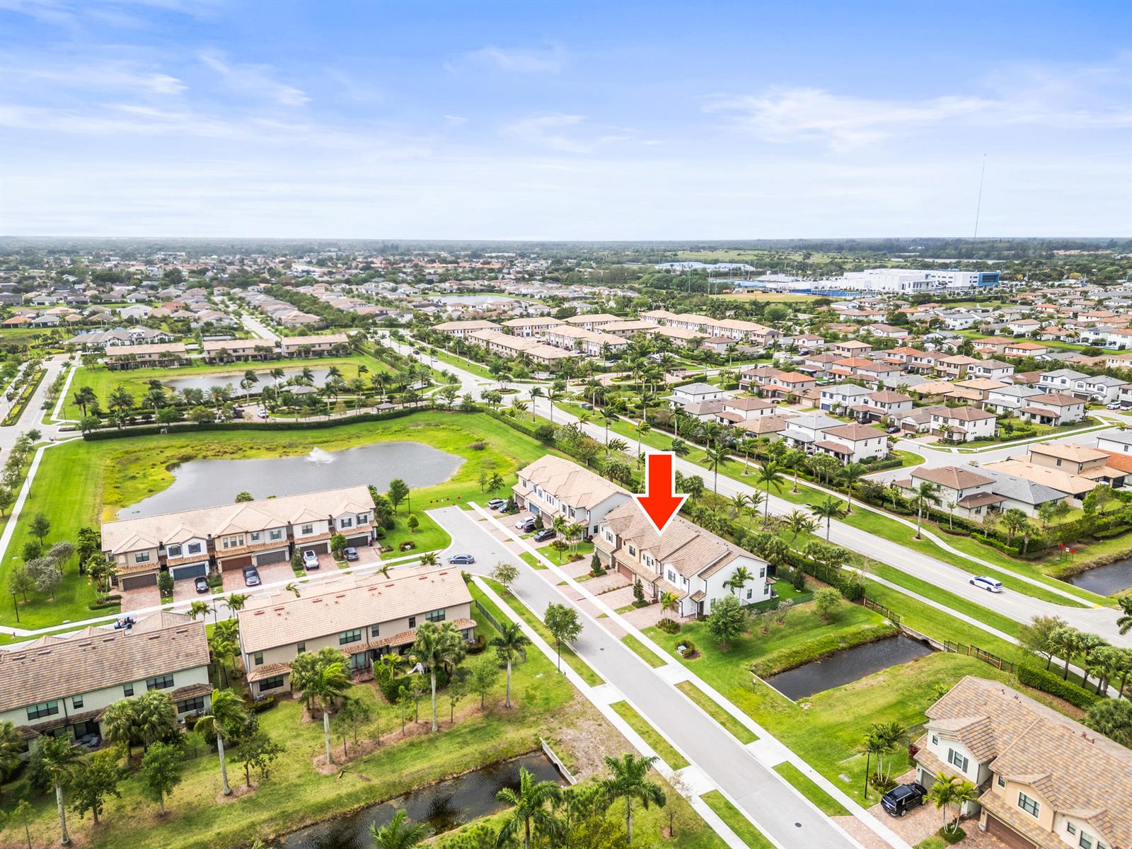 An aerial view shows a residential neighborhood with townhouses, ponds, and landscaped streets — 4739 Eventing Street, Lake Worth FL 33467, LAKE WORTH, FL