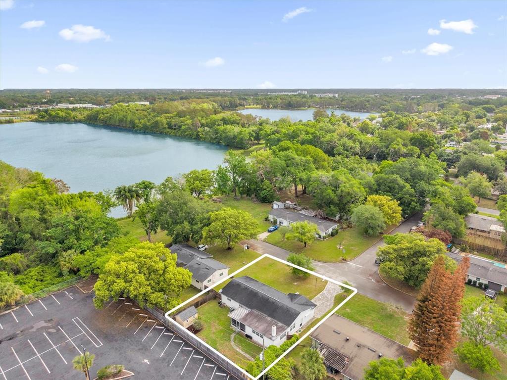 An aerial view shows a single-story house with a white exterior and a dark roof — 950 HANOVER AVENUE, WINTER PARK, FL