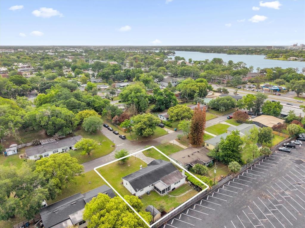 An aerial view shows a single-story house with a white exterior and a dark roof — 950 HANOVER AVENUE, WINTER PARK, FL