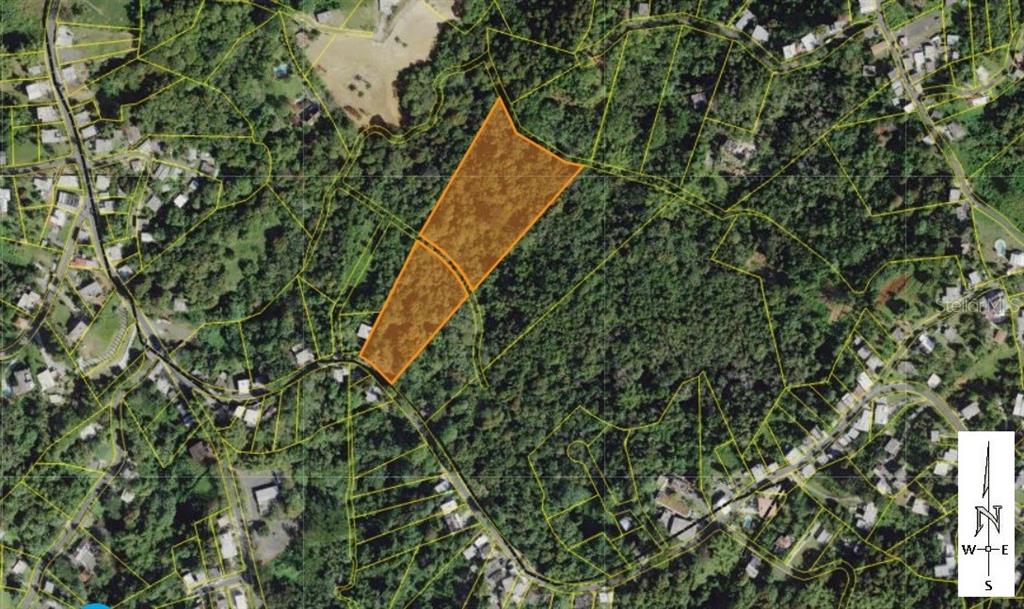 An aerial map view shows a highlighted parcel of land surrounded by trees and roads — CAMINO MORCELO, SAN JUAN, PR