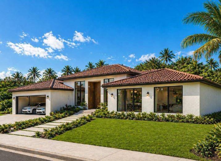 A single-story house with a tiled roof, white stucco exterior, and a two-car garage — 9PHP+MX Bocas del Toro - Marbella, Panama, FL