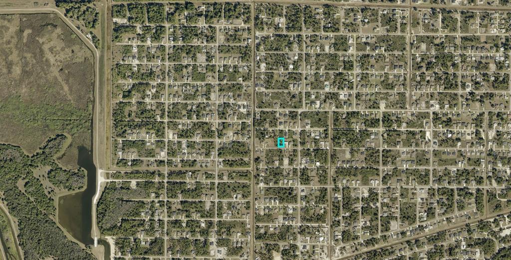 This is an aerial map view of a residential neighborhood with a highlighted property lot — 3006 40TH STREET W, LEHIGH ACRES, FL