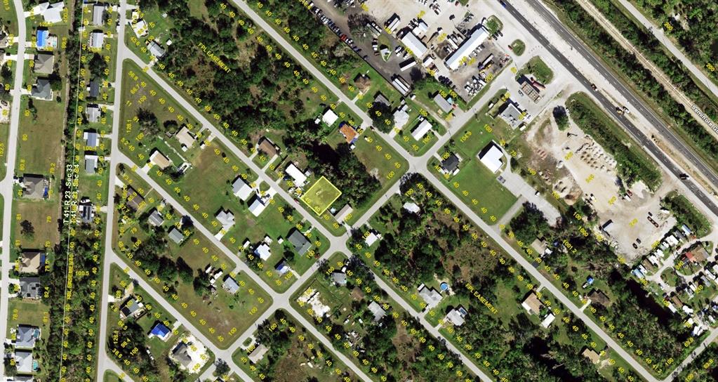 This is an aerial map showing a residential neighborhood with a highlighted property lot — 11182 2ND AVENUE, PUNTA GORDA, FL