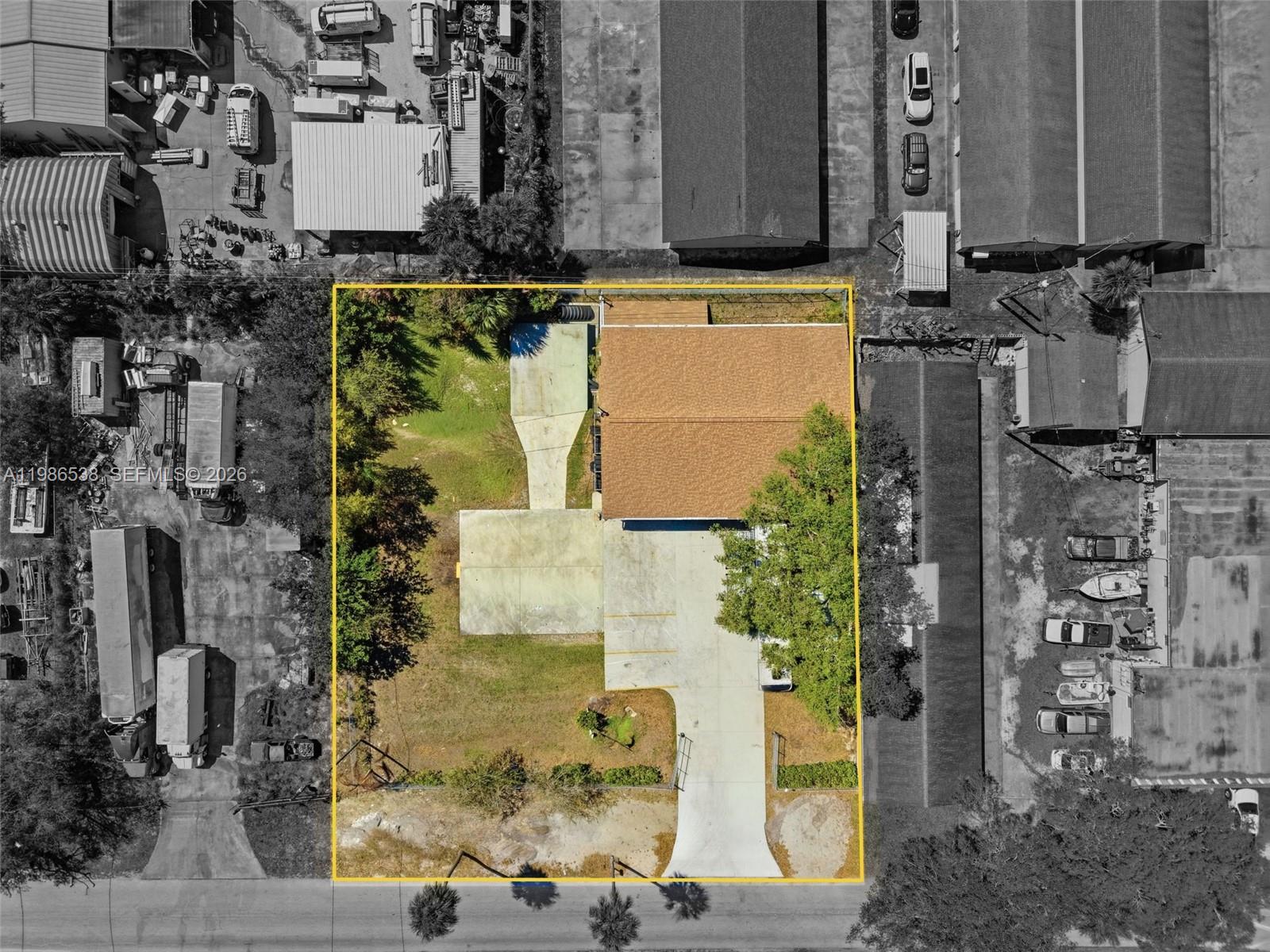 An aerial view shows a rectangular property lot with a building, driveway, and trees — 645 Old Dixie Hwy, Sebastian FL 32958, SEBASTIAN, FL