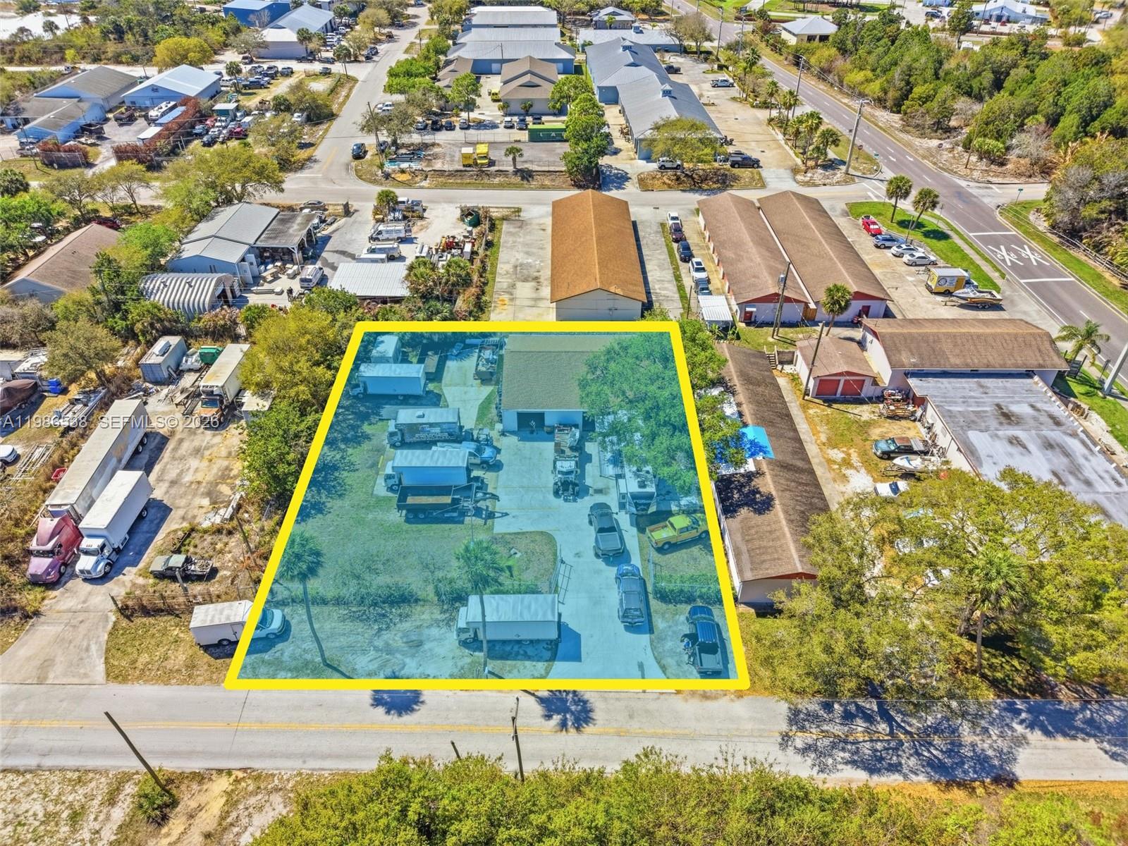 An aerial view shows a rectangular lot with a building and parked vehicles — 645 Old Dixie Hwy, Sebastian FL 32958, SEBASTIAN, FL