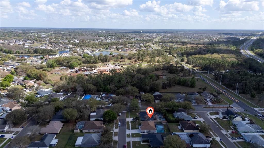 An aerial view shows a suburban neighborhood with a house marked by a location pin — 3586 YELLOW BIRD COURT, ST CLOUD, FL