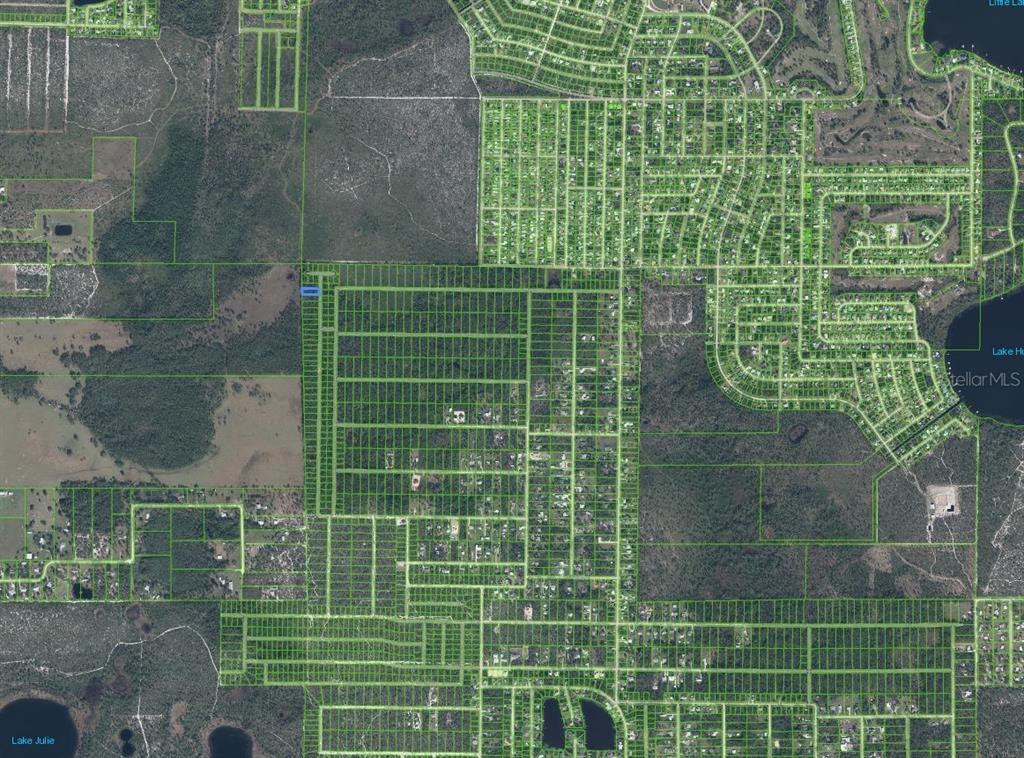 This is an aerial map showing property parcel boundaries over a rural and residential area — 4705 RHUBARB STREET, SEBRING, FL