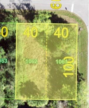 This is a map showing two adjacent rectangular land parcels labeled 1061 and 1062 — 26153 FLOWER ROAD, PUNTA GORDA, FL