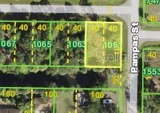 This is a map showing a highlighted vacant residential lot located on a corner — 26153 FLOWER ROAD, PUNTA GORDA, FL