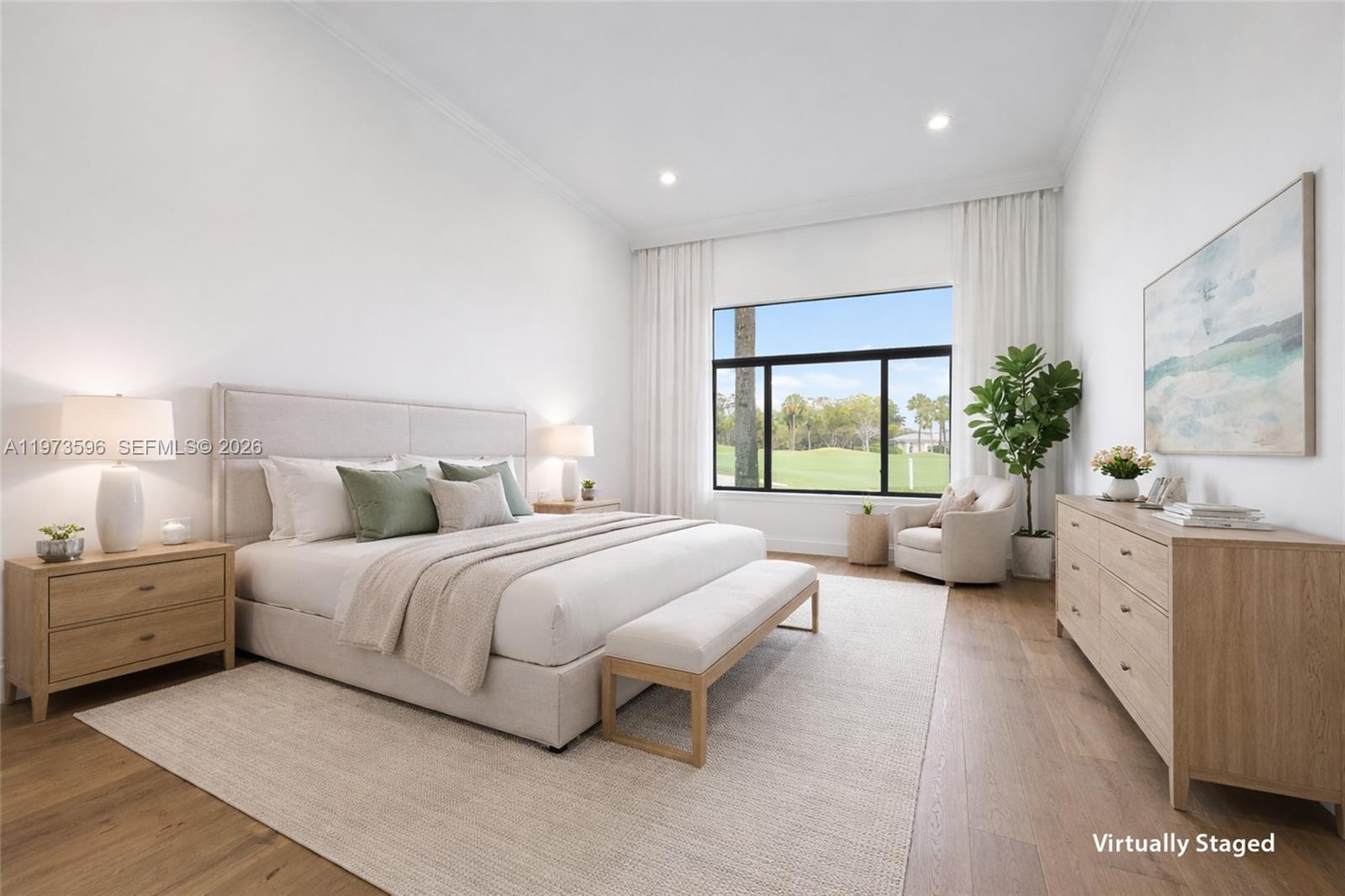 A virtually staged bedroom features a king bed, light wood furniture, and a large window — 108 Waters Edge Dr, Jupiter FL 33477, JUPITER, FL
