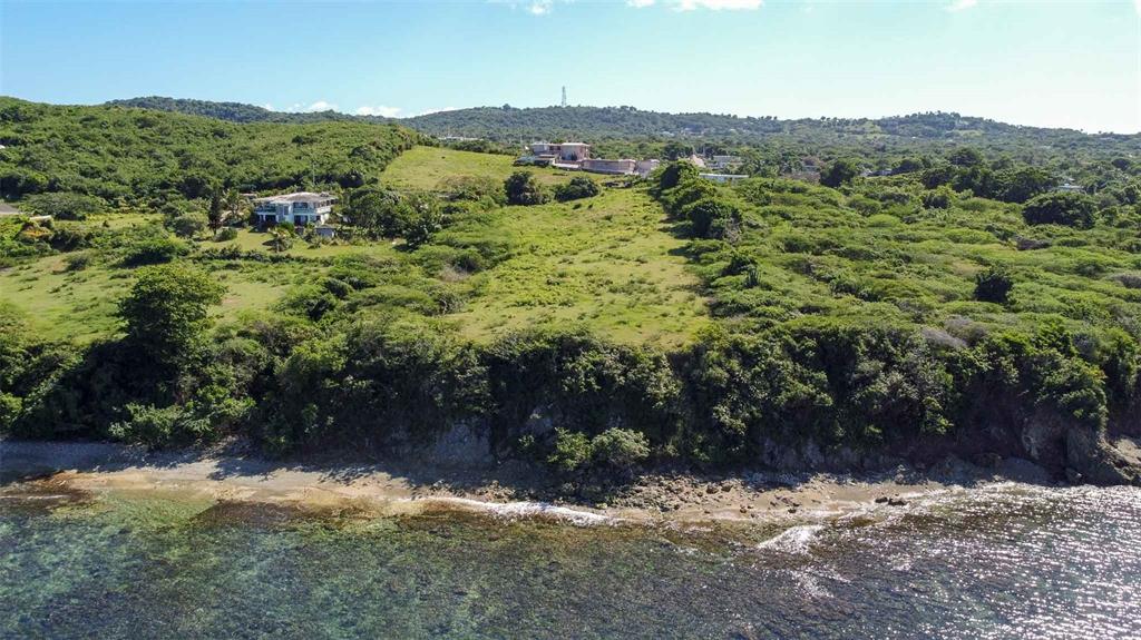 An aerial view of a coastal property featuring a grassy cliffside overlooking the ocean — 53 CALLE CANON, VIEQUES, PR