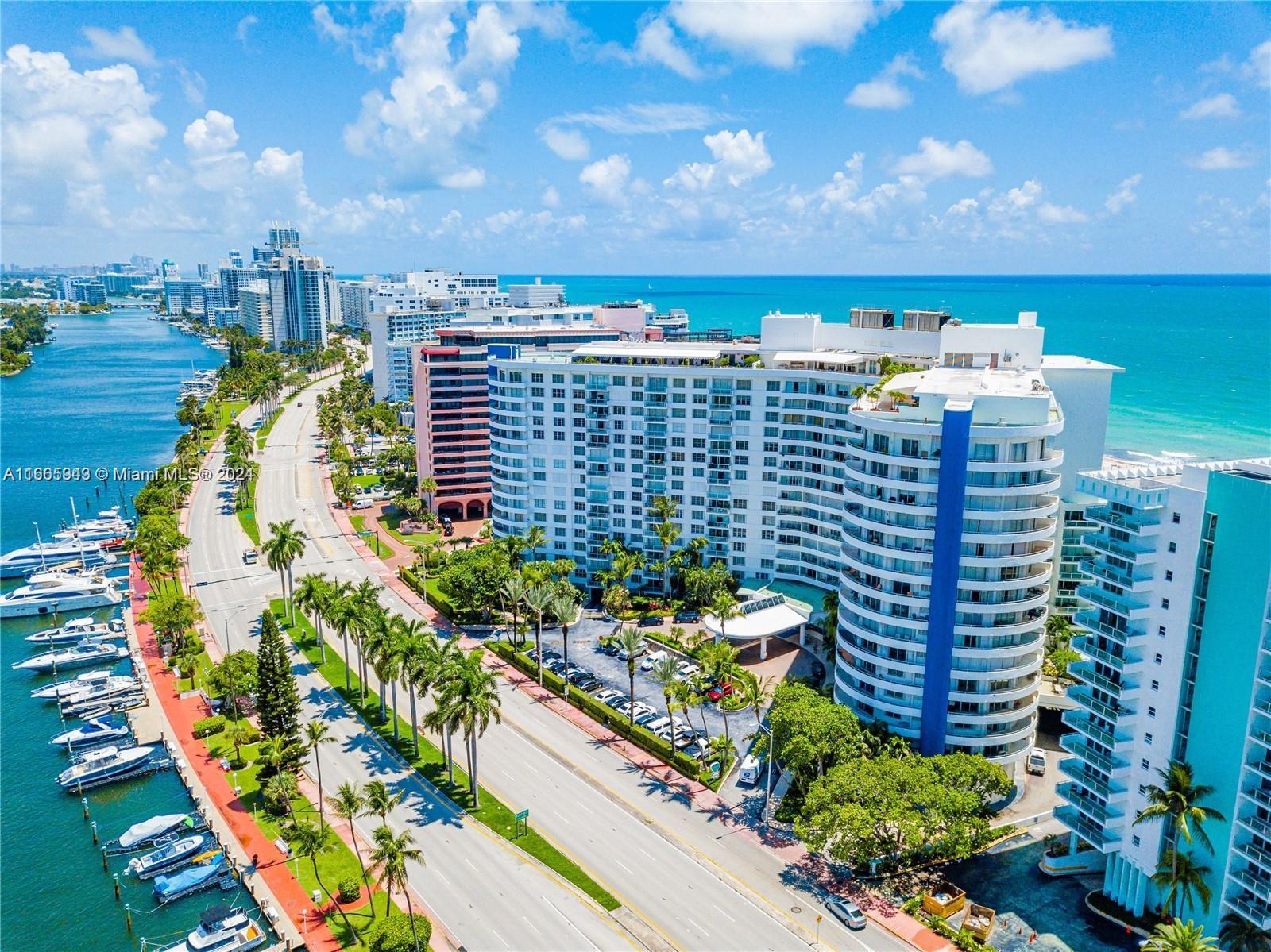 An aerial view shows a coastal road, a marina with boats, and several large apartment buildings — 5161 Collins Ave # 505, Miami Beach FL 33140, MIAMI BEACH, FL