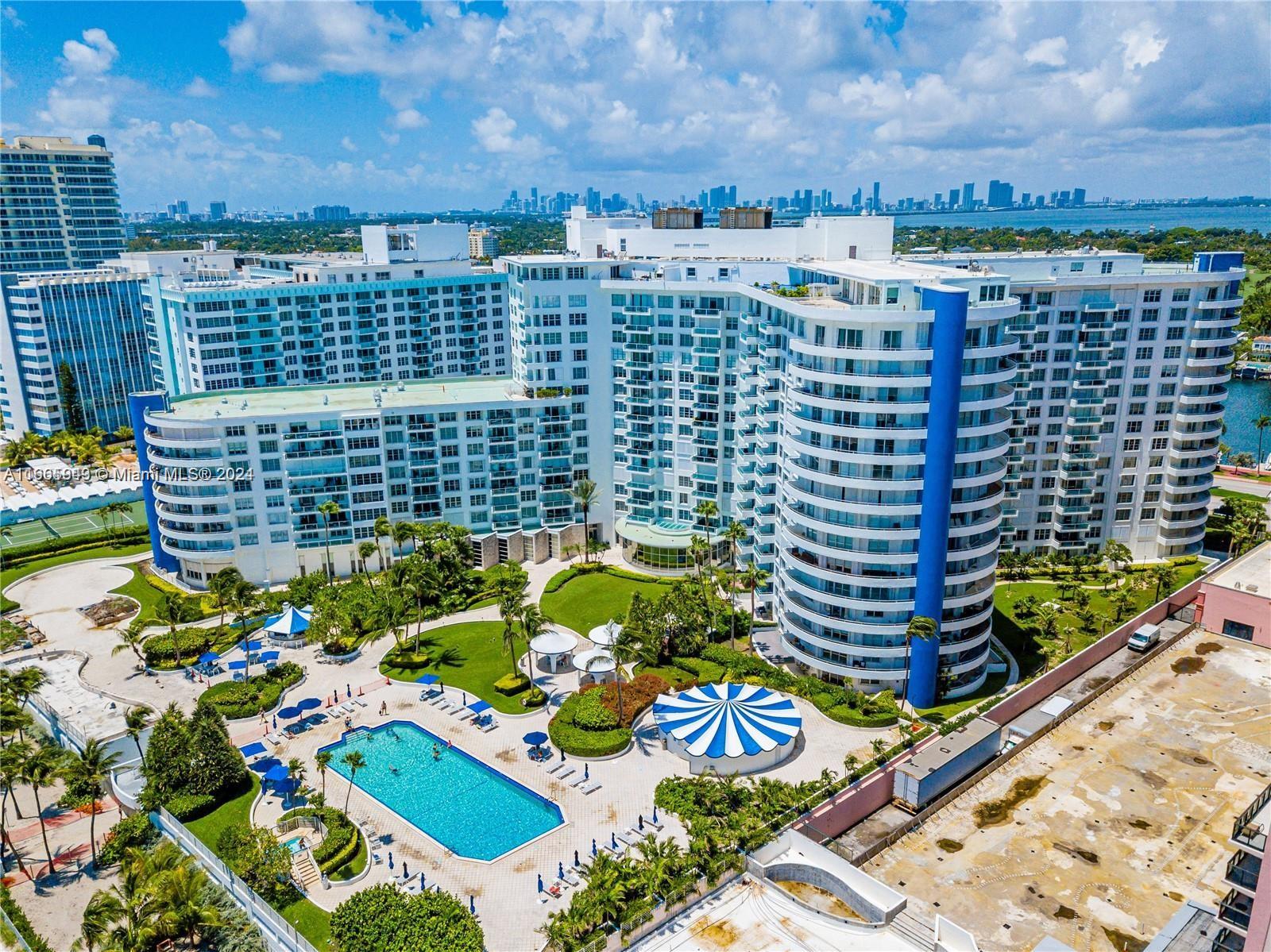 An aerial view of a large residential complex featuring a swimming pool and landscaped grounds — 5161 Collins Ave # 505, Miami Beach FL 33140, MIAMI BEACH, FL