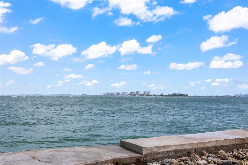 A view of a body of water with a distant skyline under a cloudy sky — 220 PASS KEY ROAD UNIT 220, SARASOTA, FL