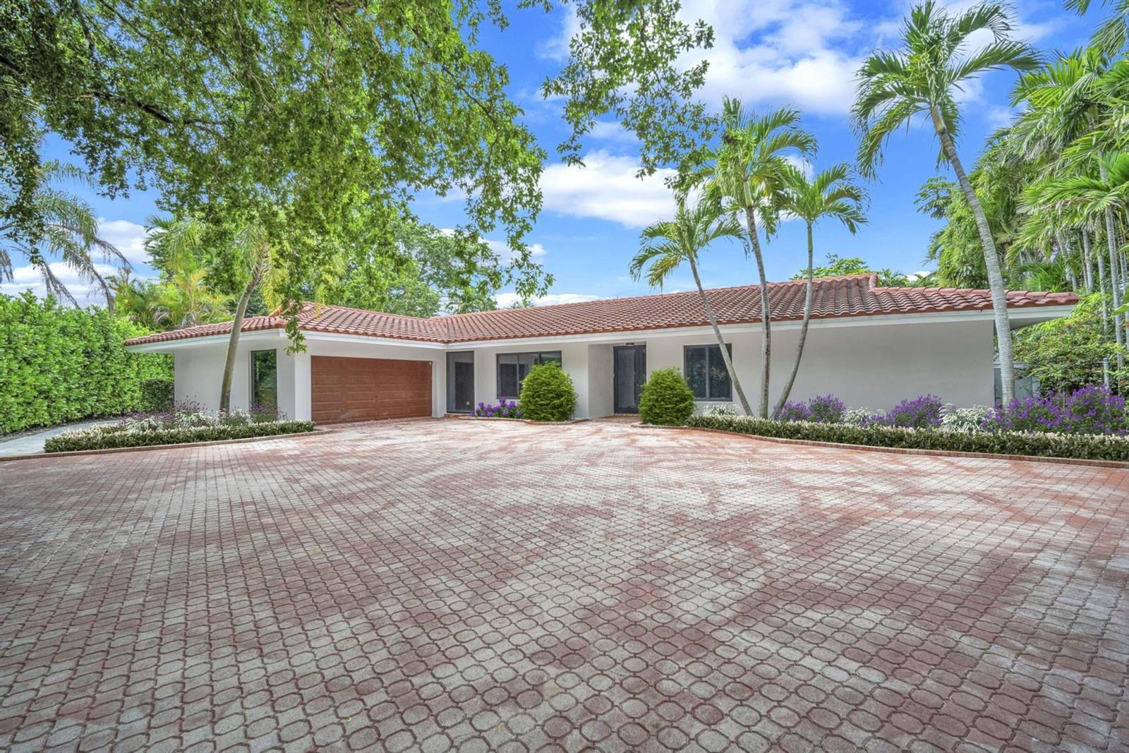 A single-story house with a tiled roof and a large paved driveway sits outdoors — 2800 Palmer Drive, Hollywood FL 33021, HOLLYWOOD, FL