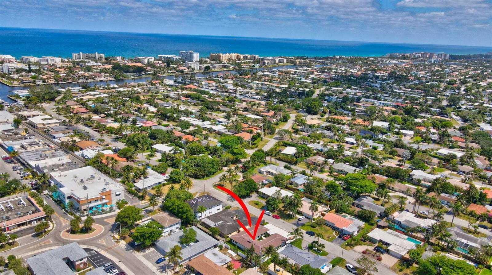 An aerial view shows a residential neighborhood with a red arrow pointing to a house — 1361 SE 4th Street # 3, Deerfield Beach FL 33441, DEERFIELD BEACH, FL