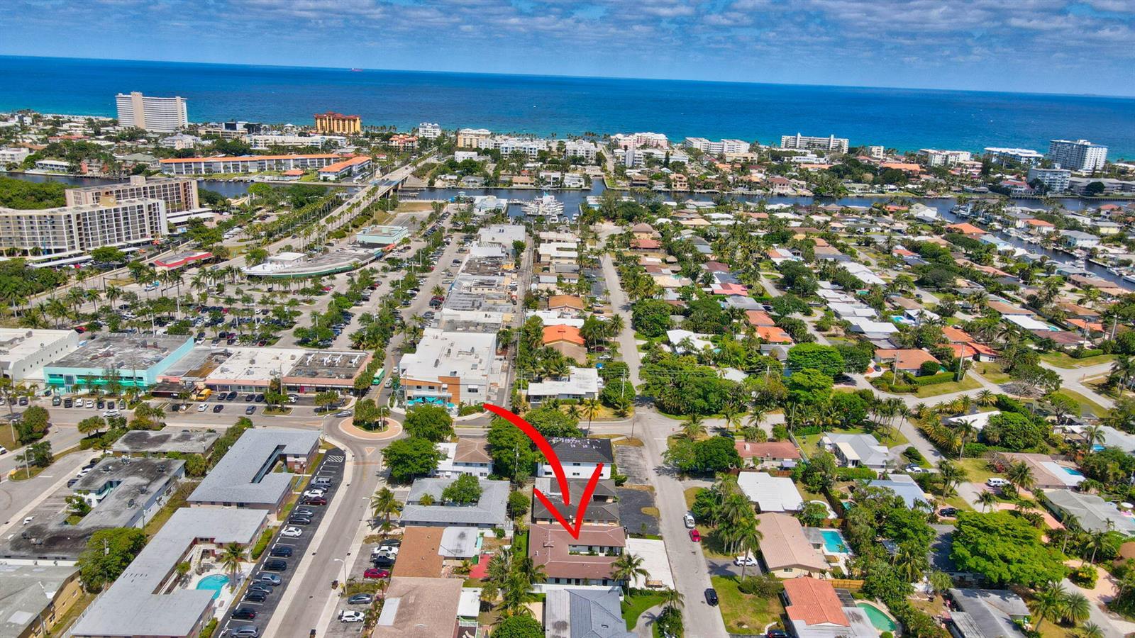 An aerial view shows a residential building with a red arrow pointing toward it — 1361 SE 4th Street # 3, Deerfield Beach FL 33441, DEERFIELD BEACH, FL