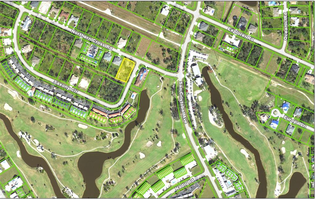 This aerial map shows a vacant residential lot highlighted in yellow within a suburban neighborhood — 1394 SAXONY CIRCLE, PUNTA GORDA, FL