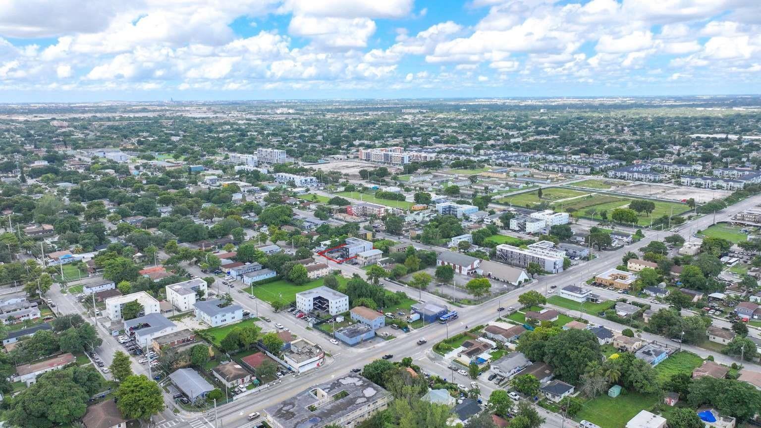 An aerial view of a residential neighborhood with a highlighted property lot — 1261 NW 59th Street, Miami FL 33142, MIAMI, FL