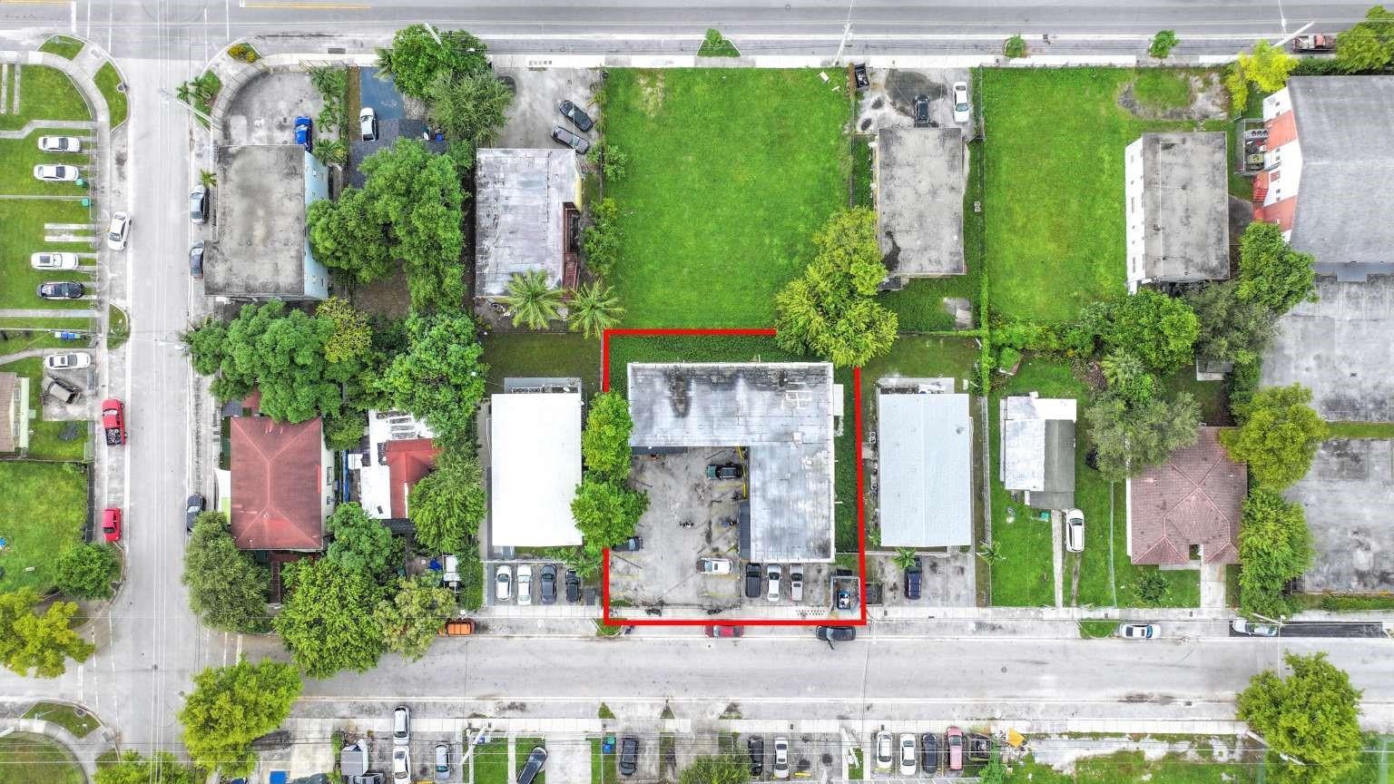 An aerial view shows a commercial building with a paved parking lot outlined in red — 1261 NW 59th Street, Miami FL 33142, MIAMI, FL