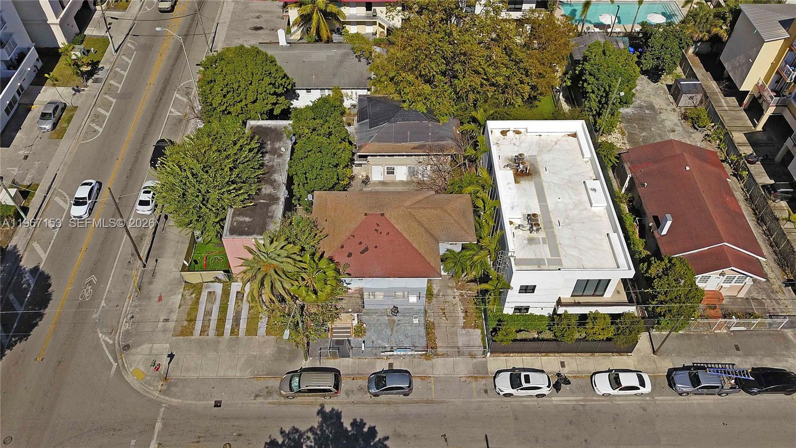 An aerial view shows a residential property with a house and a multi-story building — 767 SW 2nd St, Miami FL 33130, MIAMI, FL