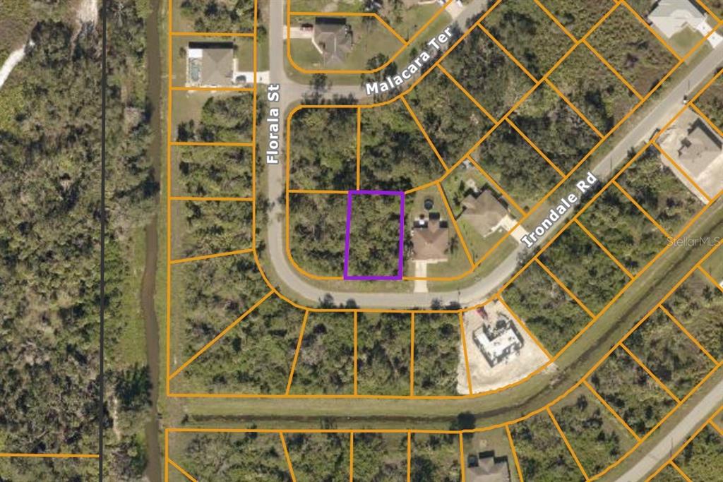This is an aerial map showing a vacant lot highlighted in purple within a residential neighborhood — IRONDALE RD, NORTH PORT, FL