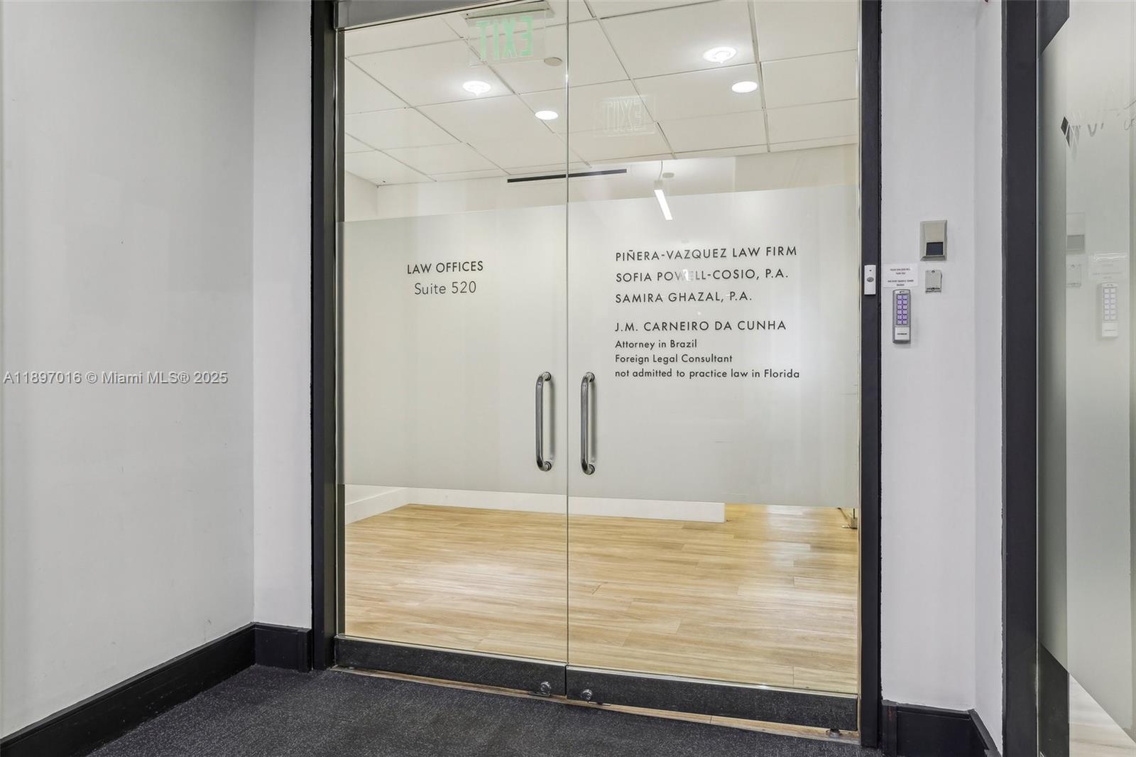 A glass double door entrance to a law office suite with light wood flooring — 1200 Brickell Ave # D, Miami FL 33131, MIAMI, FL