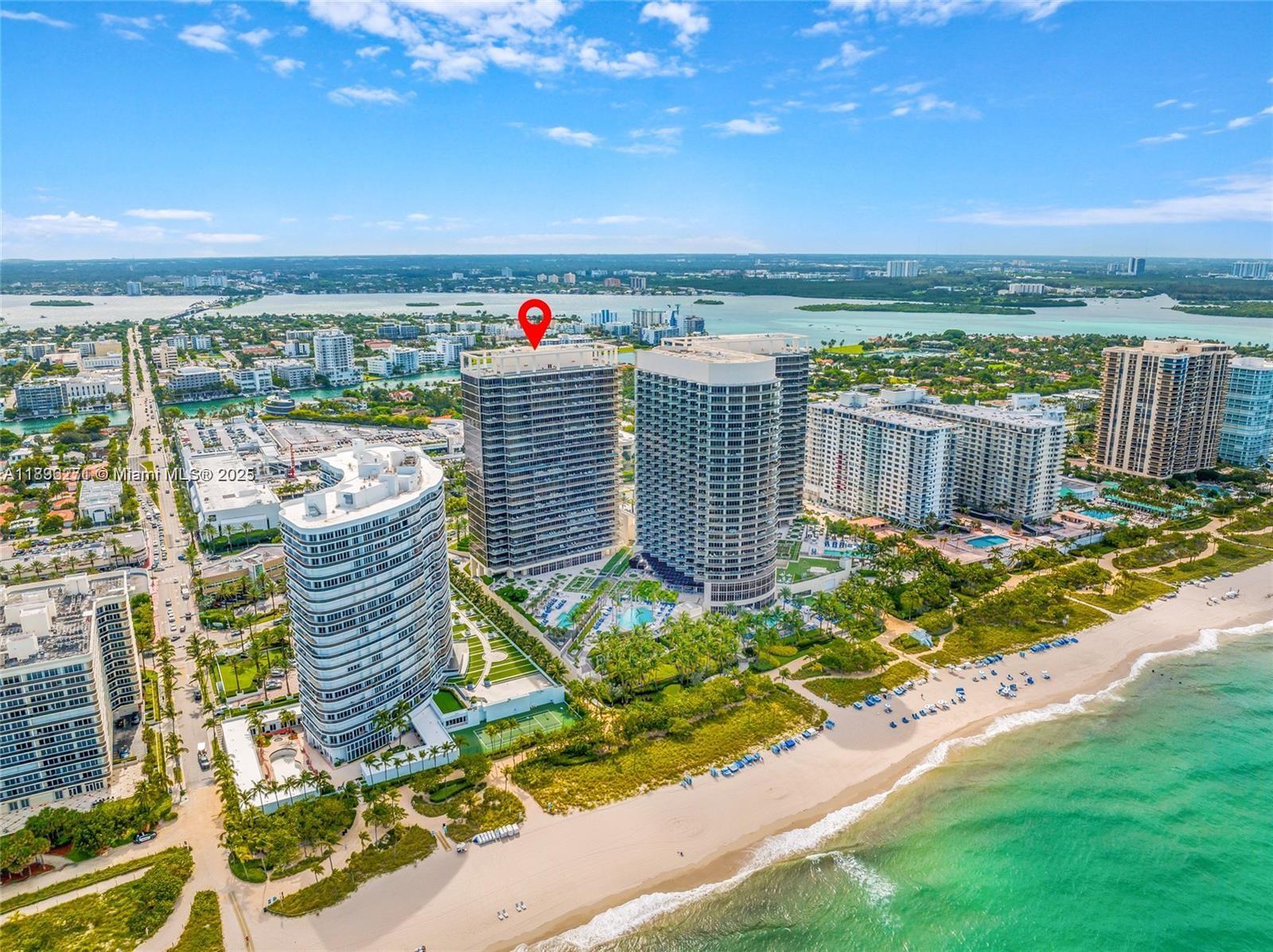 An aerial view shows high-rise residential buildings situated along a sandy beach and ocean — 9701 Collins Ave # 802S, Bal Harbour FL 33154, BAL HARBOUR, FL