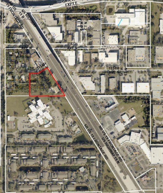 This is an aerial map showing a vacant lot outlined in red near a highway — 11400 US HIGHWAY 19 N, CLEARWATER, FL