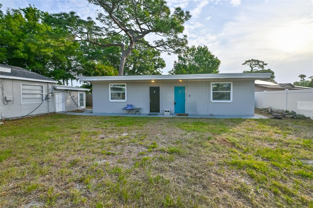 A single-story gray building with two doors labeled one and two and two windows — 1956 MCMULLEN ROAD UNIT 2, LARGO, FL